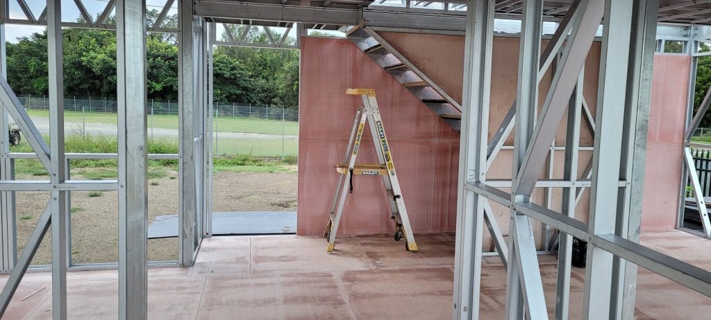 Internal light-gauge steel framing during modular building construction