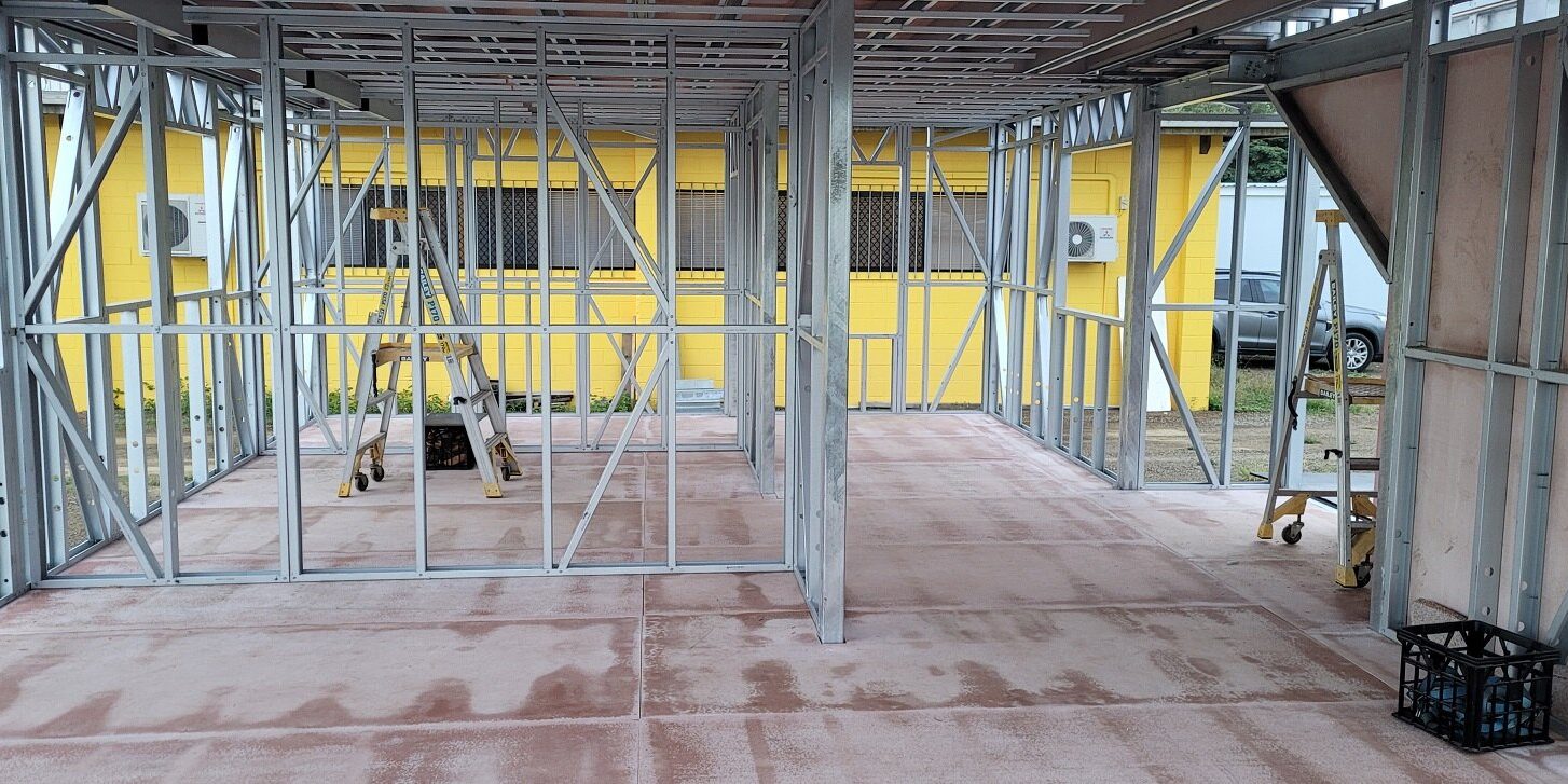 Framed interior of a modular steel building during construction