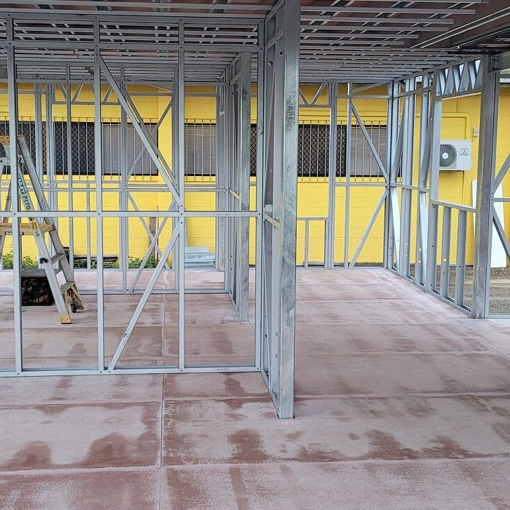 Framed interior of a modular steel building during construction