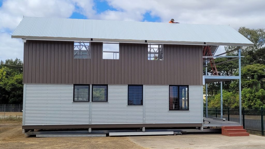 Two-storey modular steel building with roof and exterior cladding installed